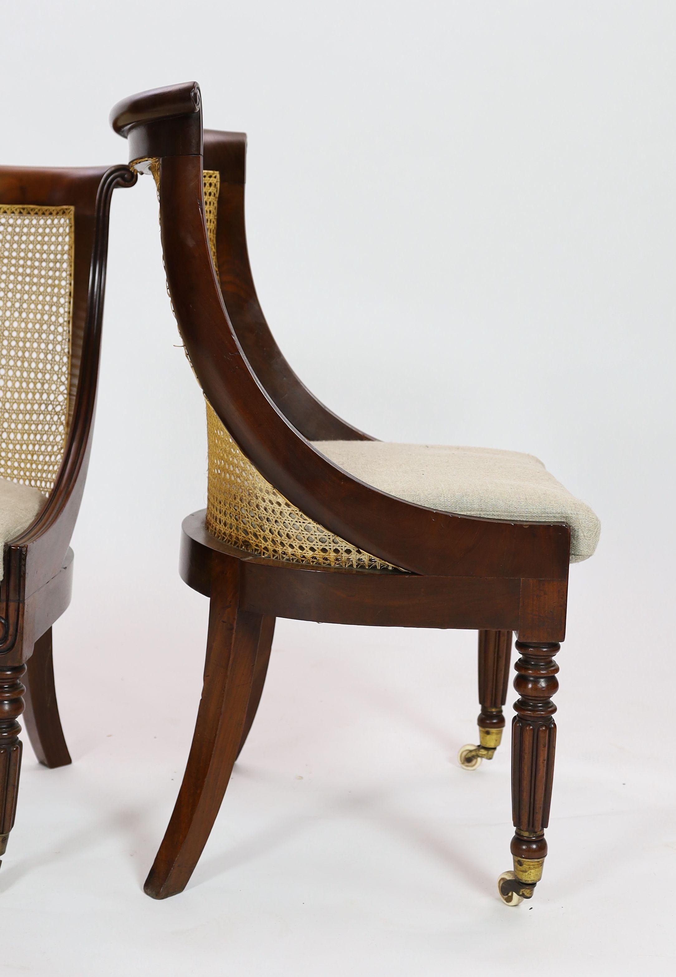 A pair of late Regency mahogany bergere side chairs